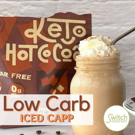 Keto Bars Low Carb Iced Cappuccino in a jar topped with whipped cream and a straw