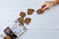 Eve's Crackers Black Sesame + reaching hand #2 - on SwitchGrocery Canada