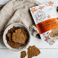 Eve's Crackers Chili Pepper Pumpkin Seed In Use on SwitchGrocery